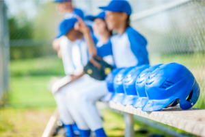 Baseball helmets on a bench